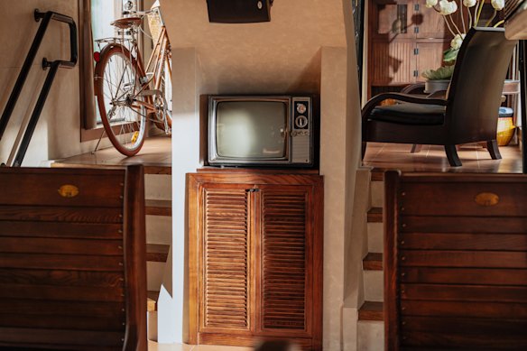 Inside the “moving cultural space” that is the Hanoi Five City Gates Tourist Train.