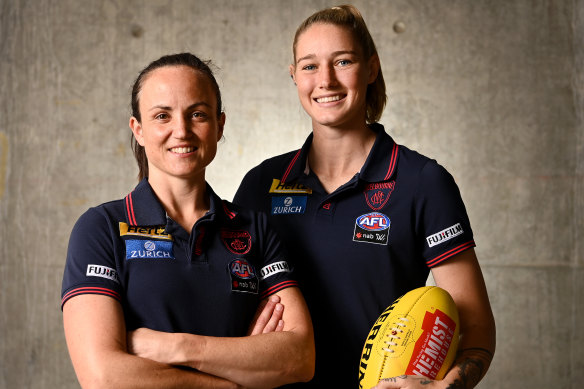 Daisy Pearce with Demons teammate Tayla Harris.