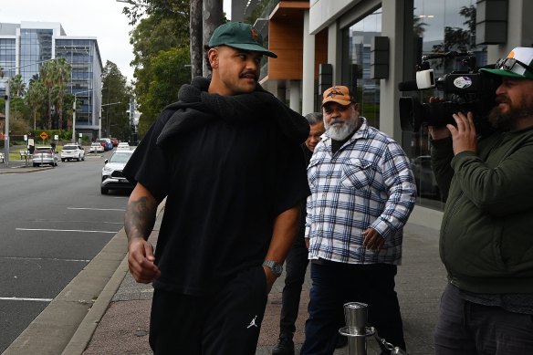 Latrell Mitchell arrives at Blues HQ with his father, Matt, on Monday afternoon.