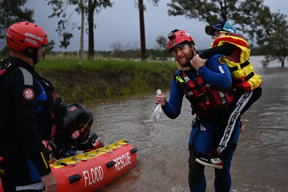 Elias, 12, and his goldfish were rescued from floodwaters in Taree.