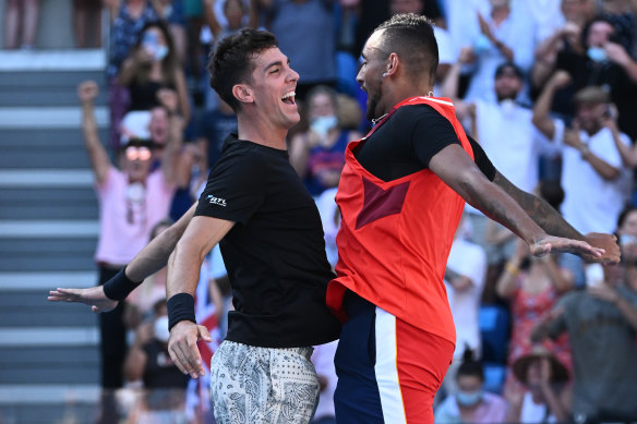 Thanasi Kokkinakis and Nick Kyrgios celebrate victory on Tuesday.