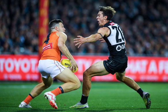 Toby Greene competes with Port Adelaide’s Connor Rozee on Saturday.