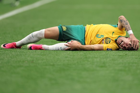 Jordan Bos lies on the pitch after he was taken down in a tackle.