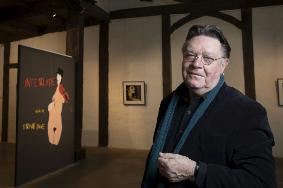 Bryan Dawe with his current exhibition at Montsalvat's Barn Gallery. 