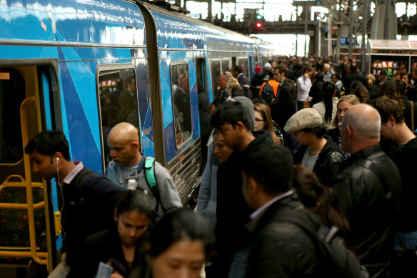 In times gone by: Commuters board a home-bound train at Southern Cross Station.