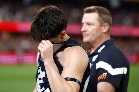 A dejected Nic Newman with coach Michael Voss after Carlton’s preliminary final loss to the Brisbane Lions.