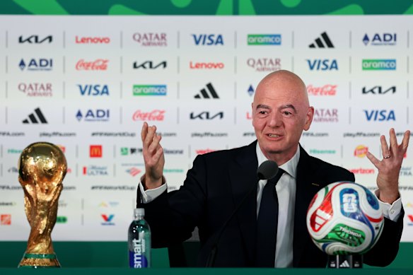 FIFA President Gianni Infantino speaks to the media alongside the World Cup trophy during a the opening press conference in Mexico.