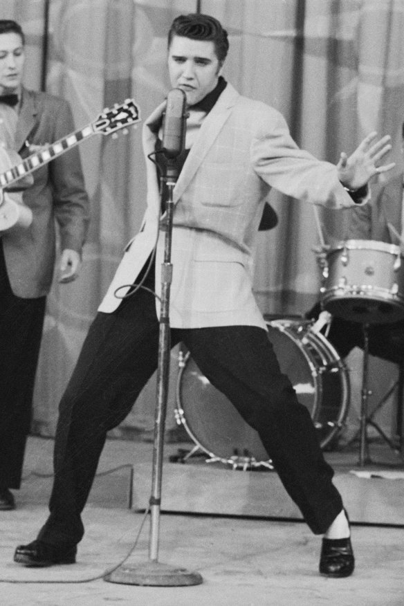 Elvis Presley in 1956. While Carl Perkins wrote Blue Suede Shoes, notes Bob Dylan, “if Elvis was alive today, he’d be the one to have a deal with Nike.”