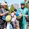 Fernando Alonso (centre) in the paddock at Albert Park on Thursday. 