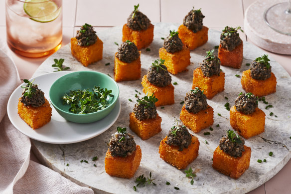Bit-sized cheesy polenta cubes topped with mushroom duxelles.