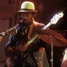 Bob Marley performing live on stage with Aston ‘Family Man’ Barrett, 1975.