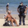 Police ask people to leave St Kilda beach during one of Melbourne’s lockdowns. 