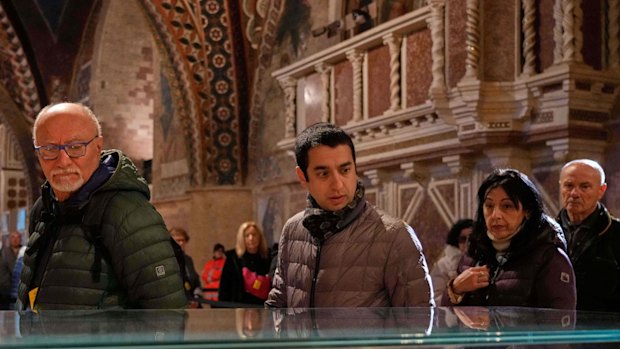 Pilgrims honour the bones of St Francis during the first public display inside the St Francis Basilica.