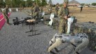 A Chinese soldier tests a machine gun on a robot dog at military exercises in Cambodia.