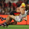 Nat Fyfe of the Dockers is challenged by Paddy Dow of the Saints.