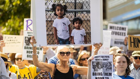 Supporters of Tamil asylum seekers at a rally .