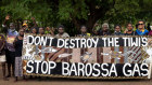 Tiwi Islanders holding banner they made to protest the Barossa Gas Project.