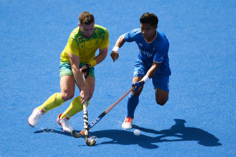 Tom Wickham and Nilakanta Sharma compete for the ball. 