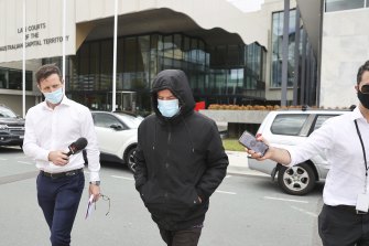 Nicholas Malcolm Reed (centre) leaves the ACT Magistrates Court after being granted bail a second time on a charge of alleged arson at Old Parliament House.