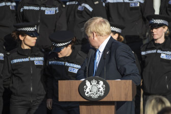 A student officer behind Prime Minister Boris Johnson nearly fainted during his press conference.