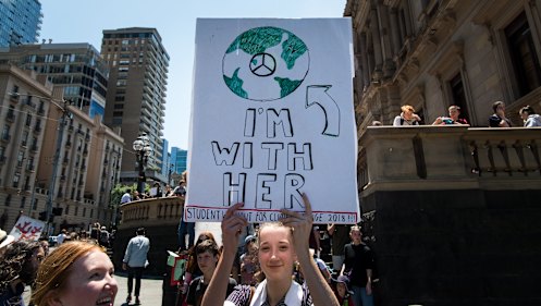 School children striking from school and protesting in the streets of Melbourne for the government to take action on climate change.