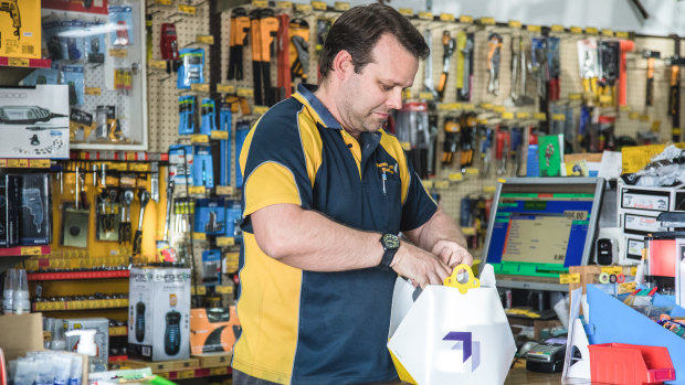 Paul Charlton from Browns Plains Hardware loads up a Wing delivery package.