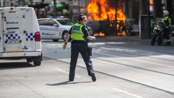 A police officer at the scene of the Bourke Street attack.