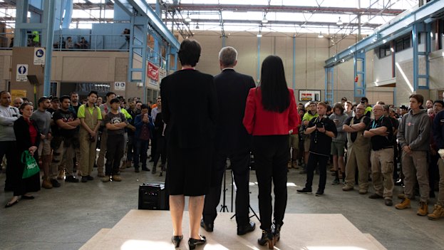 Bill Shorten, flanked by two Labor candidates, speaks to students and teachers at Holmesglen TAFE. 