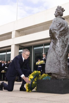Prime Minister Anthony Albanese lays a wreath during a ceremony at Parliament House on Saturday.