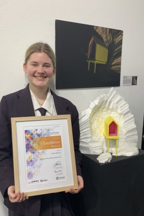 Lourdes Hill College graduate Emilia Memory, 18, with her artwork that is being showcased in a virtual exhibition at GOMA.