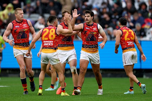 Darcy Fogarty (second from right) is one of the Crows leading their on-field revival. 