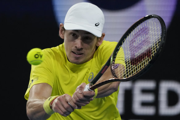 Australia’s Alex de Minaur makes a backhand return to Britain’s Cameron Norrie during their Group C match at the United Cup tennis event in Sydney.