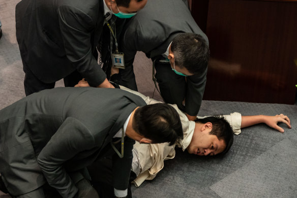 Hong Kong pro-democracy activist Ted Hui being arrested in 2020. Hui now lives in Adelaide.