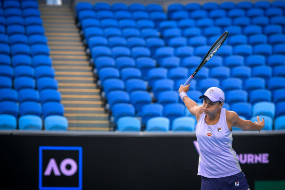Ashleigh Barty plays a shot against Ekaterina Alexandrova in an empty Margaret Court Arena. 