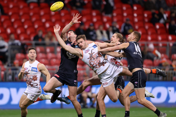 Kieren Briggs of the Giants attempts to mark at Giants Stadium.