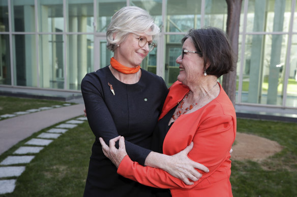 Independent MP Helen Haines (left) is congratulated by former MP for Indi Cathy McGowan after delivering her maiden speech at Parliament House in Canberra in 2019.