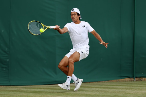 Jason Kubler plays a forehand against Dennis Novak of Austria.