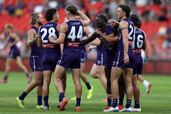 Michael Frederick of the Dockers celebrates kicking a goal.