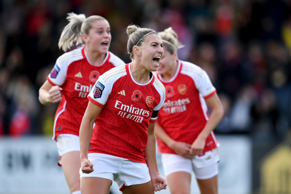 Steph Catley celebrates scoring for Arsenal.