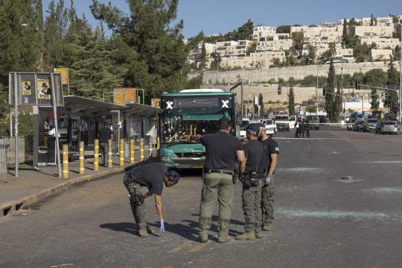 Two blasts went off near bus stops in Jerusalem on Wednesday, killing one person and injuring more than a dozen.