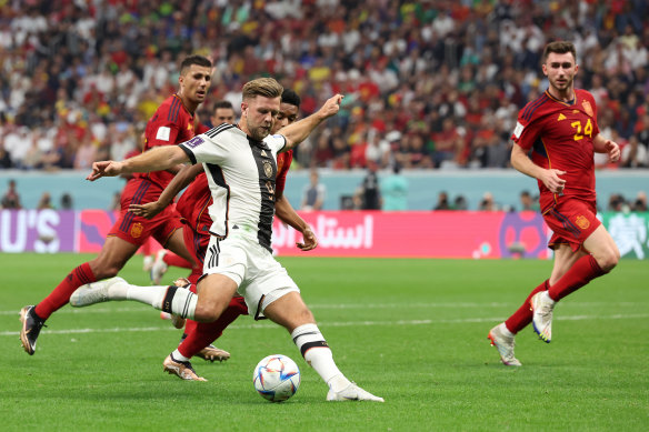 Germany’s Niclas Fuellkrug finds the all-important equaliser.