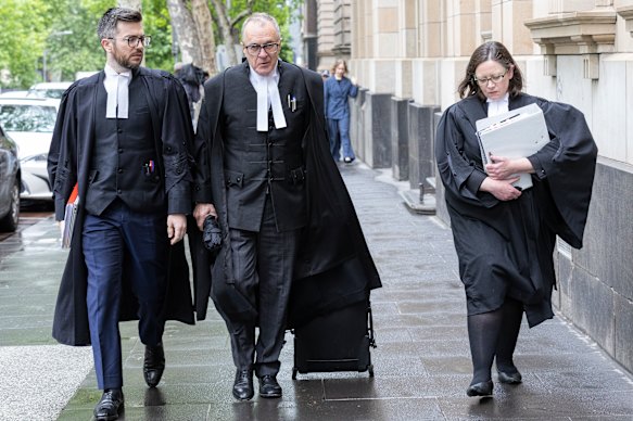 Director of Public Prosecutions Brendan Kissane, KC (centre), outside court on Friday.