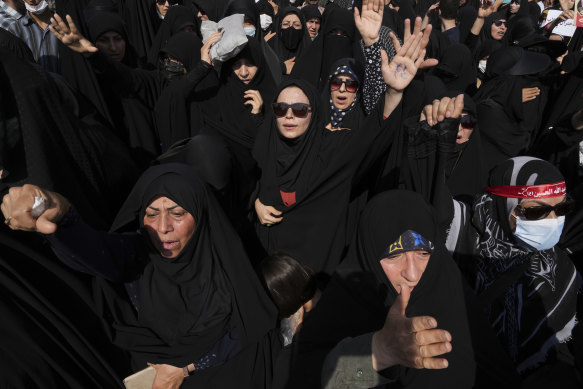 Iranian pro-government demonstrators attend a rally after their Friday prayers to condemn recent anti-government protests