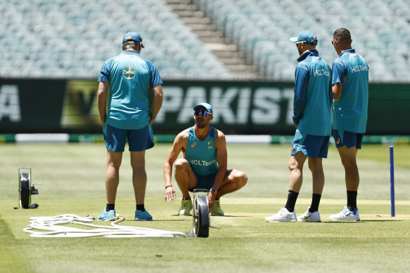 Pitch inspection: Quizzical Australians at the MCG.