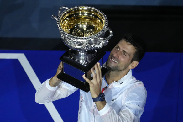 Novak Djokovic lifts an unprecedented 10th Australian Open crown in Melbourne last year.