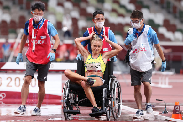 Genevieve Gregson leaves the Tokyo track in distress. 