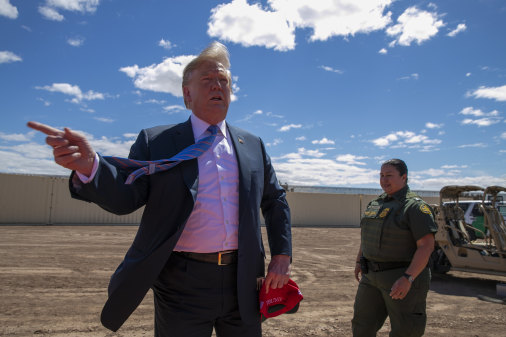 US President Donald Trump visits a section of the border wall in April. 