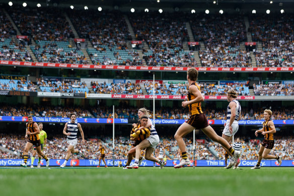 Ginnivan is tackled by Zach Guthrie during the loss to the Cats.