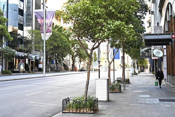 The main business strip of St Georges Terrace in Perth’s CBD is as barren as the eastern states’ cities since a mask mandate was brought in.  