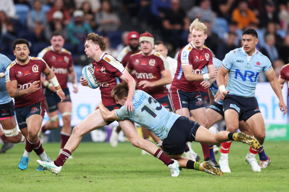  Tim Ryan of the Reds is tackled of the Reds